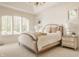 Serene bedroom featuring a large window, comfortable bed, and stylish nightstands at 6560 Dawson Lake Dr, Indianapolis, IN 46220