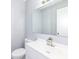 Bathroom with a modern vanity, large mirror, and convenient toilet placement at 7322 S Sherman Dr, Indianapolis, IN 46237