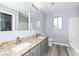 Bathroom featuring double sinks, granite countertops, and modern fixtures at 7322 S Sherman Dr, Indianapolis, IN 46237