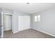 This bedroom features neutral walls, plush carpeting, closet, and natural light at 7322 S Sherman Dr, Indianapolis, IN 46237