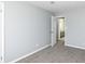 This bedroom features neutral walls, plush carpeting, and an ensuite bathroom at 7322 S Sherman Dr, Indianapolis, IN 46237