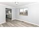 Dining room with sleek floors, neutral walls, and a view into the updated kitchen at 7322 S Sherman Dr, Indianapolis, IN 46237