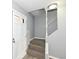 Inviting entryway with gray walls, carpeted stairs and white trim, offering a warm welcome at 7322 S Sherman Dr, Indianapolis, IN 46237
