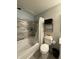 This bathroom features updated tiles in the shower, along with a white shower curtain at 8360 S Evening Dr, Pendleton, IN 46064