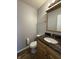 Powder room features granite counters and wooden vanity at 8360 S Evening Dr, Pendleton, IN 46064