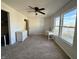 Bedroom featuring carpet flooring, ceiling fan, white furnishings, and window with neighborhood views at 8360 S Evening Dr, Pendleton, IN 46064
