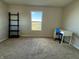 Bedroom with a window offering neighborhood views, a sleek white desk and a stylish blue chair at 8360 S Evening Dr, Pendleton, IN 46064