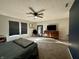 Bright bedroom with carpeted floors, large windows, and a ceiling fan at 8360 S Evening Dr, Pendleton, IN 46064