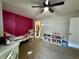 Bedroom with closet, bookshelves, trundle bed, ceiling fan, and desk at 8360 S Evening Dr, Pendleton, IN 46064