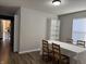 Bright dining room with wood floors, window and adjacent kitchen access at 8360 S Evening Dr, Pendleton, IN 46064