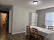 Dining room with wood floors, window, access to kitchen and a view of dog at 8360 S Evening Dr, Pendleton, IN 46064