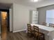 Dining room with wood floors, natural light, and adjacent access to kitchen at 8360 S Evening Dr, Pendleton, IN 46064