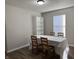 Bright dining room with wood floors and a large window, great for entertaining at 8360 S Evening Dr, Pendleton, IN 46064