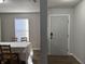 Entryway features a door, window, and a glimpse into the dining room at 8360 S Evening Dr, Pendleton, IN 46064