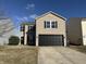 Charming two-story home with a well-kept lawn and a two-car garage, perfect for Gathering living at 8360 S Evening Dr, Pendleton, IN 46064