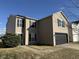 Attractive two-story home showcasing its front facade with black shutters, a two-car garage, and a tidy yard at 8360 S Evening Dr, Pendleton, IN 46064