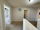Hallway showcasing neutral paint, carpeting and access to different rooms of the home at 8360 S Evening Dr, Pendleton, IN 46064