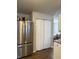 The kitchen has a modern stainless steel refrigerator and white cabinets at 8360 S Evening Dr, Pendleton, IN 46064
