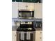 The kitchen has modern stainless steel appliances, granite countertops, and white cabinets at 8360 S Evening Dr, Pendleton, IN 46064