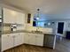 Updated kitchen features stainless steel appliances, granite countertops, and modern white cabinetry at 8360 S Evening Dr, Pendleton, IN 46064