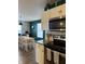 The modern kitchen is equipped with stainless steel appliances and sleek white cabinets at 8360 S Evening Dr, Pendleton, IN 46064