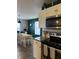 The modern kitchen is equipped with stainless steel appliances and sleek white cabinets at 8360 S Evening Dr, Pendleton, IN 46064