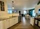 Updated kitchen features stainless steel appliances, granite countertops, and modern white cabinetry at 8360 S Evening Dr, Pendleton, IN 46064