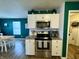 The modern kitchen is equipped with stainless steel appliances and sleek white cabinets at 8360 S Evening Dr, Pendleton, IN 46064