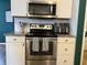 The modern kitchen is equipped with stainless steel appliances and sleek white cabinets at 8360 S Evening Dr, Pendleton, IN 46064