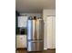 The kitchen has a modern stainless steel refrigerator and white cabinets at 8360 S Evening Dr, Pendleton, IN 46064