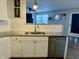 Updated kitchen features stainless steel appliances, granite countertops, and modern white cabinetry at 8360 S Evening Dr, Pendleton, IN 46064