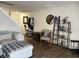 Cozy living room with wood floors, a decorative ladder shelf, and a comfortable armchair at 8360 S Evening Dr, Pendleton, IN 46064