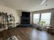 Corner living room with fireplace and large bright windows at 8360 S Evening Dr, Pendleton, IN 46064