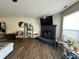 Open-concept living area with a fireplace and mantel-mounted television at 8360 S Evening Dr, Pendleton, IN 46064