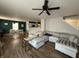 Bright living room featuring a large sectional sofa, dining area, and an open floor plan at 8360 S Evening Dr, Pendleton, IN 46064