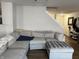 Comfortable living area featuring a sectional sofa and easy access to the upper floor at 8360 S Evening Dr, Pendleton, IN 46064