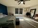 Main bedroom with dark blue accent wall and natural light from large windows at 8360 S Evening Dr, Pendleton, IN 46064