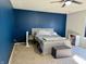 Stylish main bedroom with an accent wall, neutral carpeting and a ceiling fan at 8360 S Evening Dr, Pendleton, IN 46064