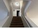 Carpeted stairway leading upstairs, offering a secure transition between levels at 8360 S Evening Dr, Pendleton, IN 46064