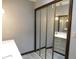 Bathroom featuring a closet with mirror doors and a partial view of the vanity at 8940 Black Hawk Ln, Indianapolis, IN 46234