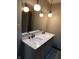 Bathroom features dual sink vanity, a large mirror, and unique light fixtures at 8940 Black Hawk Ln, Indianapolis, IN 46234
