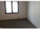 Bedroom featuring white walls and a window, with hard surface flooring at 8940 Black Hawk Ln, Indianapolis, IN 46234