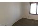 Bedroom featuring white walls and a window, with hard surface flooring at 8940 Black Hawk Ln, Indianapolis, IN 46234