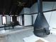A-frame living room features a fireplace, and front door view at 8940 Black Hawk Ln, Indianapolis, IN 46234