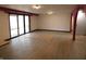 A living room with red architectural arches, a sliding glass door, and light-colored floors at 8940 Black Hawk Ln, Indianapolis, IN 46234