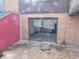 Brick patio area with view into the back of the home through sliding glass doors at 8940 Black Hawk Ln, Indianapolis, IN 46234