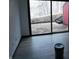 Room with a slider door leading to the backyard at 8940 Black Hawk Ln, Indianapolis, IN 46234
