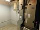 Utility room featuring a modern furnace, new flooring, and electrical panel at 8940 Black Hawk Ln, Indianapolis, IN 46234