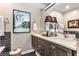 Stylish bathroom with a double vanity, dark wood cabinets, and modern fixtures at 932 N Broadway St # 1, Indianapolis, IN 46202