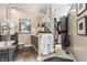 Well-appointed bathroom with a soaking tub, glass shower, dark tile, and adjacent walk-in closet, blending convenience and style at 932 N Broadway St # 1, Indianapolis, IN 46202